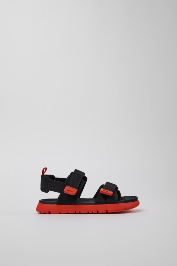 Neu Eingetroffen Camper Oruga - Schwarze Kindersandale aus Textil. Neu Eingetroffen Camper Oruga - Schwarze Kindersandale aus Textil.
