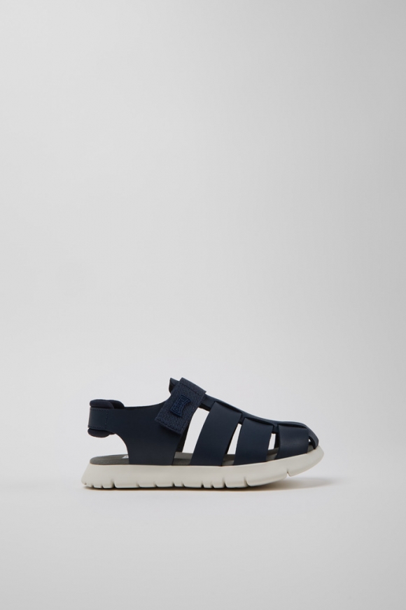 Neu Eingetroffen Camper Oruga - Blauer Kindersandal aus Leder und Textil. Neu Eingetroffen Camper Oruga - Blauer Kindersandal aus Leder und Textil.